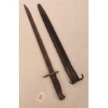 A sword bayonet and scabbard dated 1913. Length of blade 16¾'