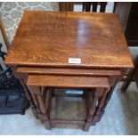 A nest of three oak occasional tables