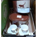 Six collector's cups and saucers in three tin boxes