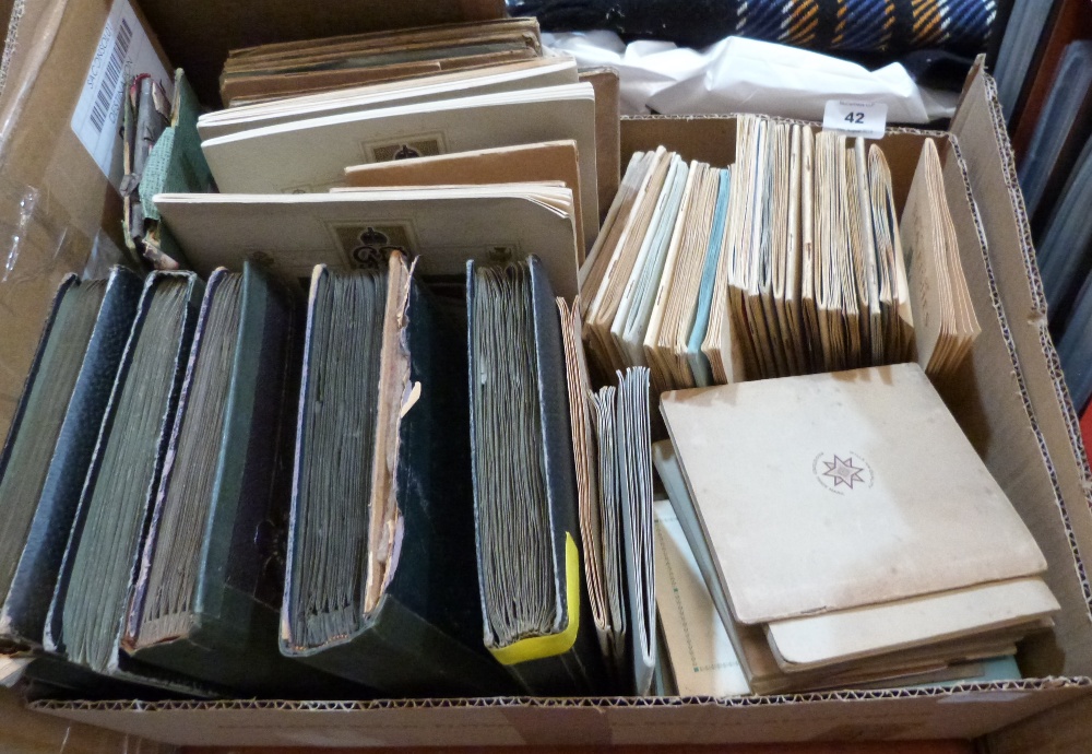 A box of cigarette cards in albums