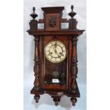 A Vienna style walnut wall clock with two train movement. 27' high