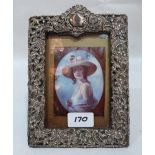 A Victorian silver faced photograph frame. London 1899. 8' high