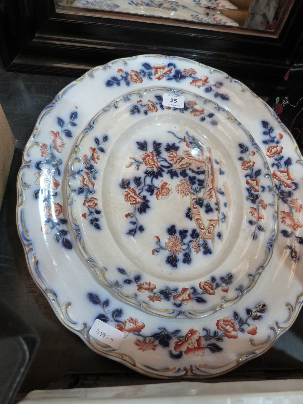 Two Victorian 'Davenport' meat plates, the larger 21' wide (cracked)