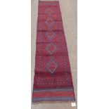 A Meshwani carpet runner. 2.63m x 0.61m