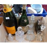 Three decanters, two Champagne bottles and other glassware