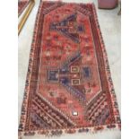 A red ground eastern rug. 86' x 41'