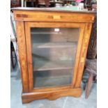 A Victorian walnut and inlaid pier cabinet. 28' wide