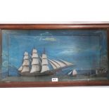 A 19th century cased marine diorama with a three masted clipper, other shipping and a lighthouse,