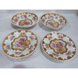 Two Sevres style bowls and seven plates, painted with roses and enriched with gilding. One plate A.