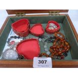 A box of jewellery to include a necklace of amber beads