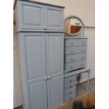 A painted pine bedroom suite comprising single wardrobe, chest of drawers and dressing table