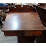 A Victorian mahogany clerks desk with shaped gallery and sloping fall. 24' wide