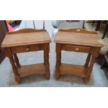 A pair of pine bedside tables with frieze drawers