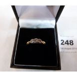 A three stone diamond ring. Diamond weight 0.4cts approx. In gold marked 18. 3.2g gross. Size M