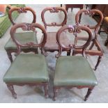A set of five Victorian rosewood balloon back dining chairs.