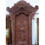 A fine and magnificent Balinese doorway, profusely carved all over with figures, foliage,