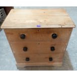 A Victorian pine chest of three long drawers. 29' wide