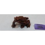 A Japanese carved treen frog. 3' long