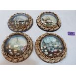 A group of four Edwardian shell-work souvenir dioramas with marine or pier lithographs in colours,