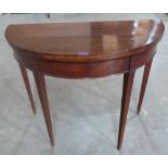 A 19th century mahogany demi-lune card table on square tapered legs. 36' wide