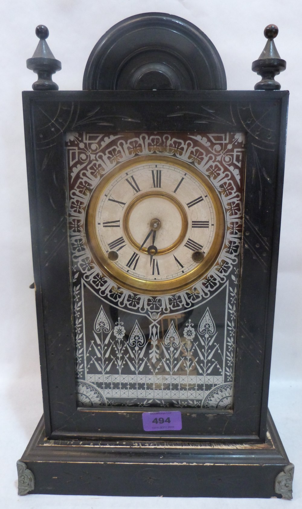 An American ebonised mantle clock. 17' high