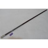 A military swagger stick, the pommel with embossed armorial for Volunteer Battalion The Buffs