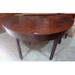 A mahogany demi-lune table on square legs. 54' wide