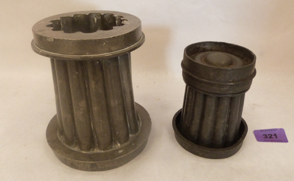 Two pewter moulds, the larger 6" high