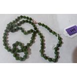 A necklace of green hardstone beads