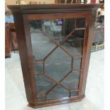 A mahogany hanging corner cupboard enclosed by an astragal glazed door. 49' high
