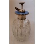 A cut glass atomiser scent bottle with sterling silver and blue guilloche enamel cover. 5¼' high