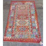 A wool Choli Kilim rug 1.55m x 0.95m