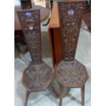 Two Welsh oak spinning chairs, each carved with thistles to the backs and seats