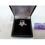 A 9ct white gold tourmaline and diamond ring. Size N. 3.4g gross