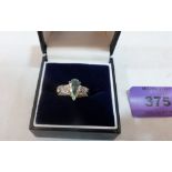 A 9ct aqua coloured stone and diamond ring. Size M. 3.6g gross