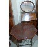 A mahogany octagonal centre table, an oval mirror and a walnut bureau