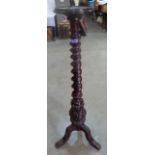 A Victorian mahogany barleytwist turned torchere on tripod support. 47' high