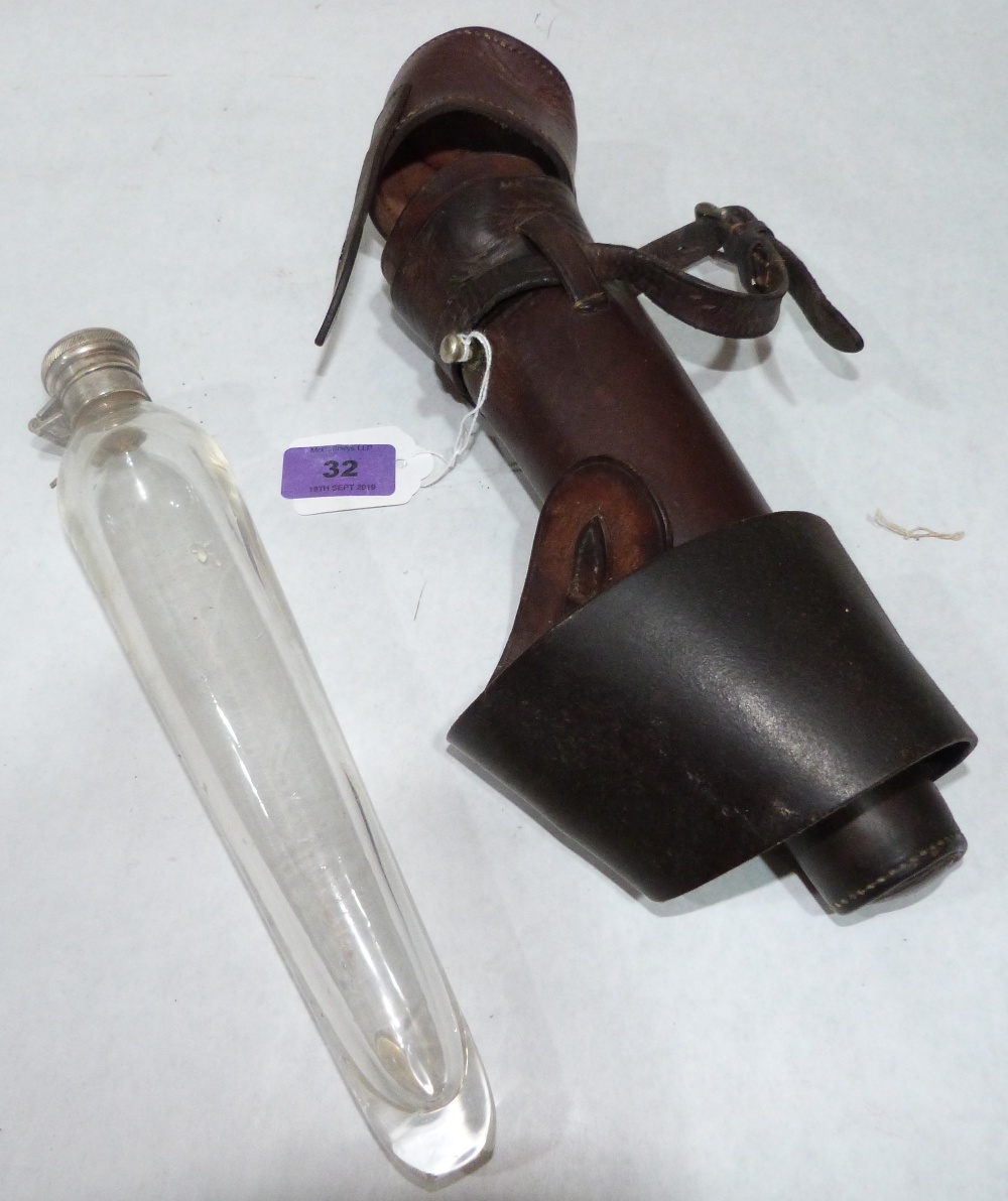 A leather cased hunting flask. 10½' high