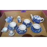 A collection of blue and white and other doll's teaware