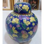 A Chinese jar and cover, all over painted with peonies, chryanthemums and ruyi. 10' high