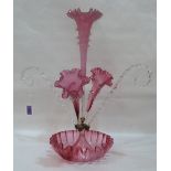 A Victorian cranberry and clear glass epergne. 21' high. Base cracked