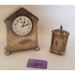 A silver engine turned dressing table clock and a silver pepperette