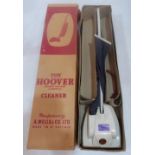A Hoover toy vacuum cleaner. Original box