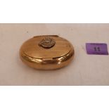 A brass oval tobacco or snuffbox with applied horse head emblem. 3¼' wide