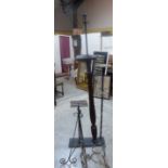 Two wrought iron plant stands and a lamp holder with reeded mahogany column