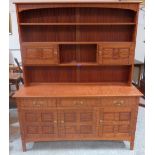 A hardwood colonial style dresser with raised rack. 62' wide