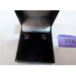 A pair of 9ct amethyst earrings. 1.1g gross