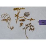 A 9ct photograph pendant; three yellow metal chains with three pendants and a charm, all unmarked