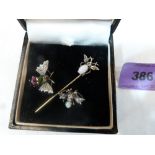 Two gem set silver fly clips and a Tiepin