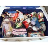 A case of vintage souvenir dolls